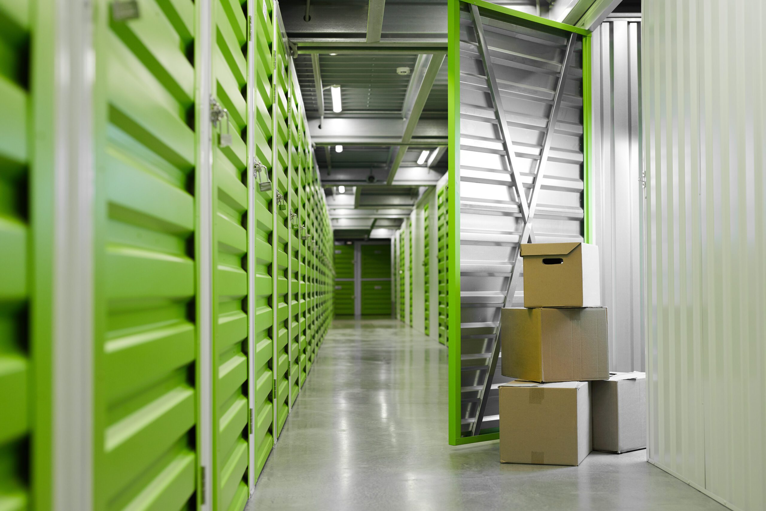 Man Moving Boxes in Self Storage Unit